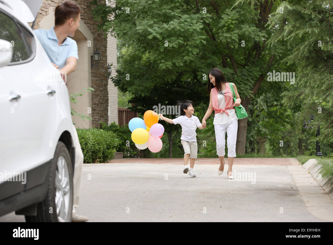 Boy with his parents Stock Photo - Alamy