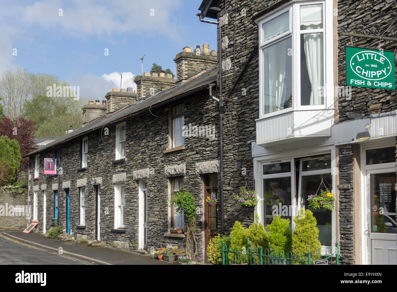 Lakeland terraced cottages in Windermere, with the Little Chippy, a traditional English fish and chip shop on Beech Street, Windermere, Cumbria, Stock Photo