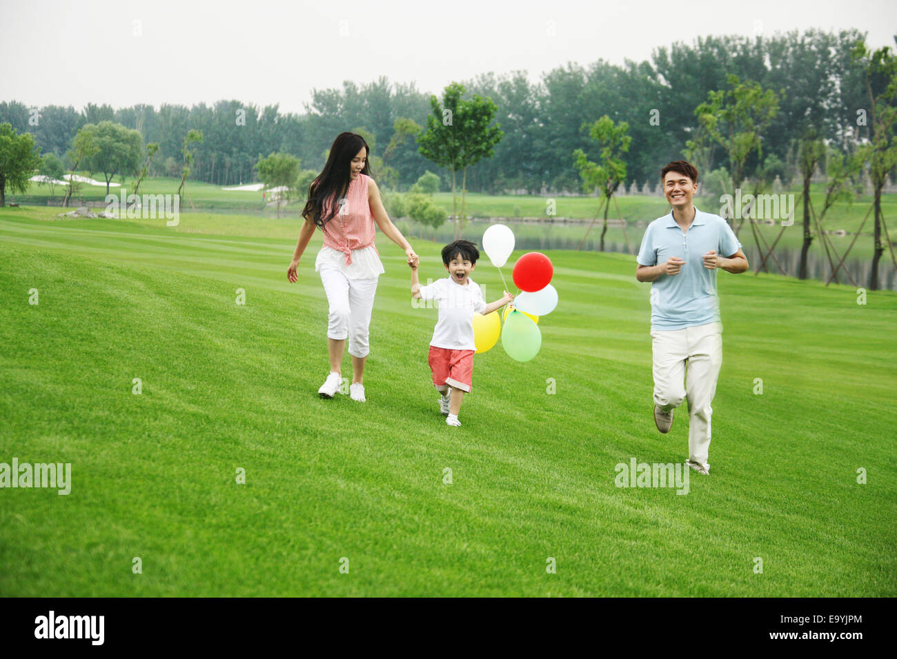 Boy with his parents Stock Photo - Alamy