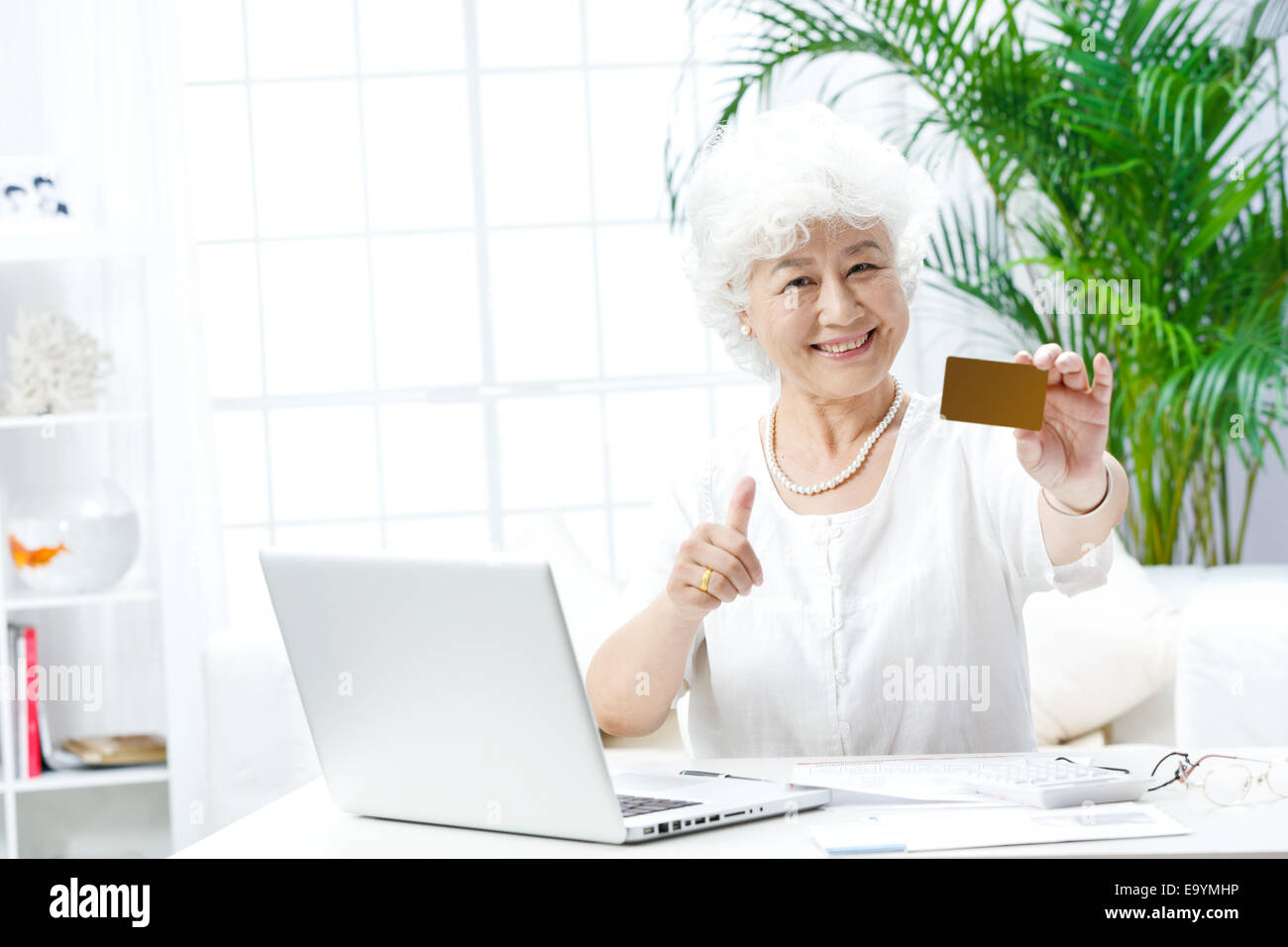 Seniors holding thumbs up hi-res stock photography and images - Alamy