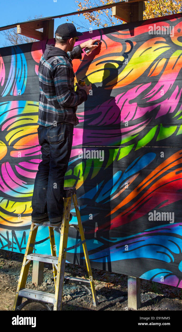 Detroit, Michigan Street artist at work as a block club develops vacant lots into a