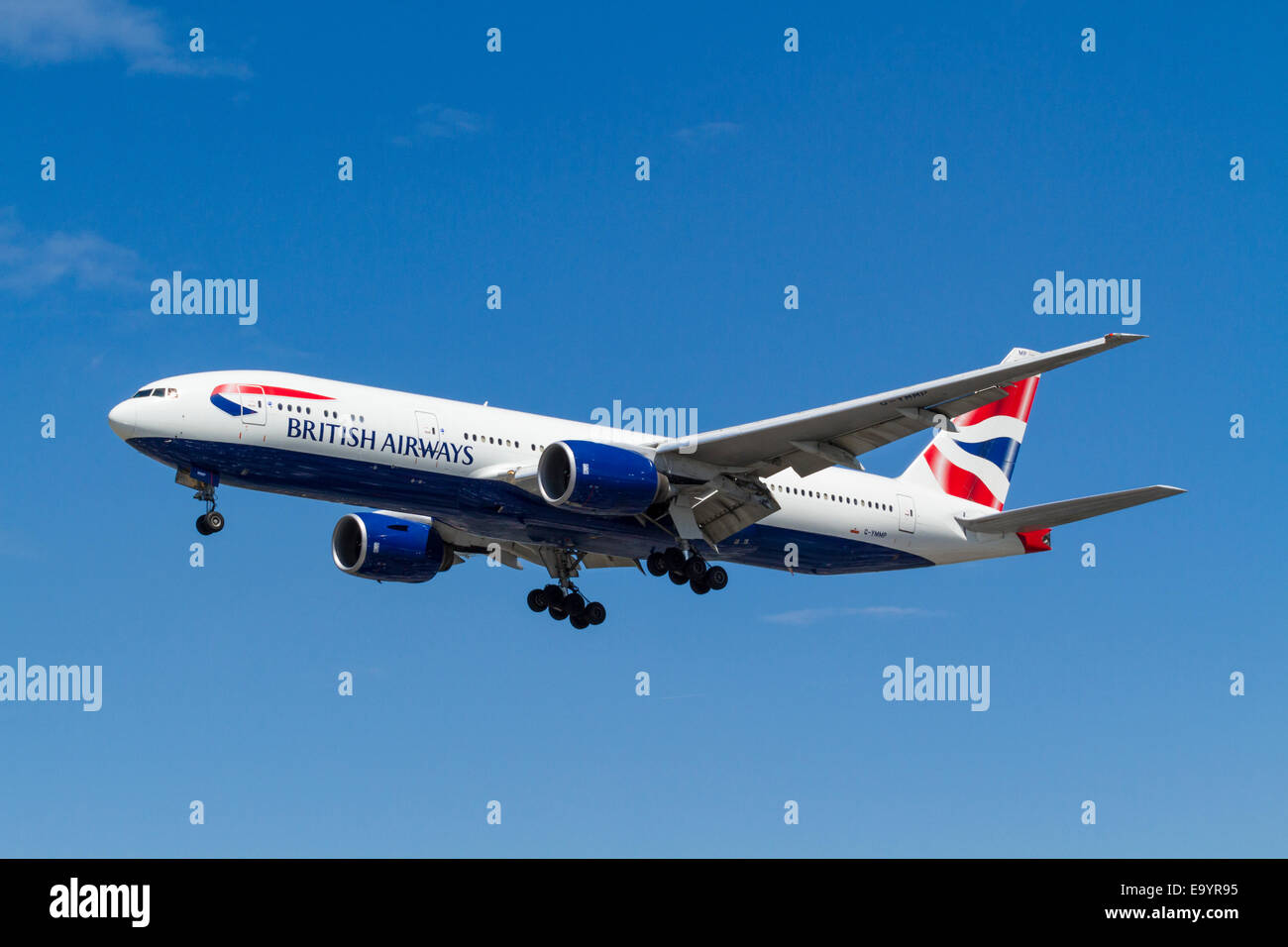 British Airways Boeing 777 plane, G-YMMP, on its approach for landing at London Heathrow, England, UK Stock Photo
