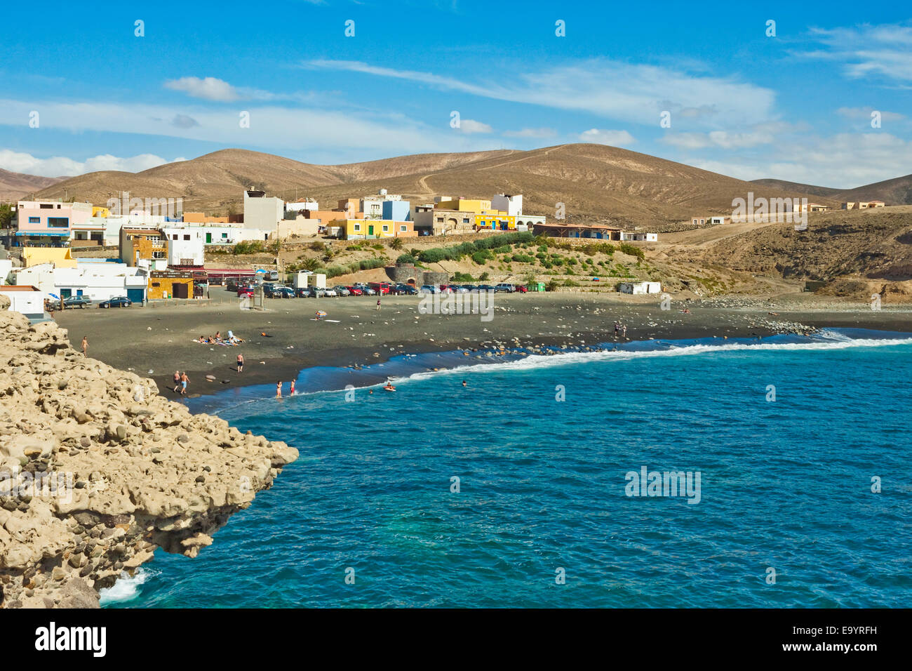 Small west coast black sand beach resort, popular for its caves & cliff walk; Ajuy, Pajara, Fuerteventura, Canary Islands, Spain Stock Photo