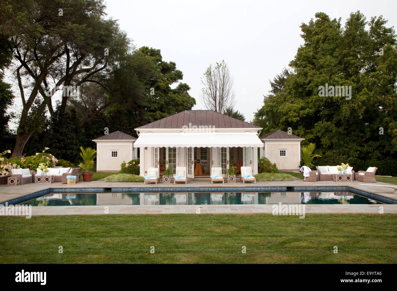 Swimming pool and pool house. Stock Photo