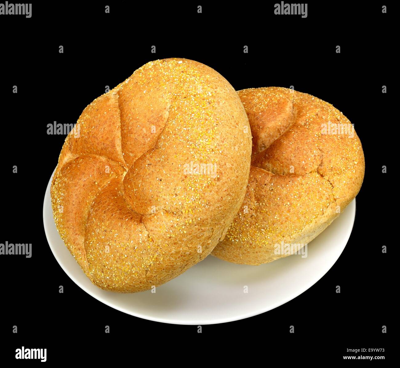 Whole wheat kaiser rolls on a black background Stock Photo Alamy