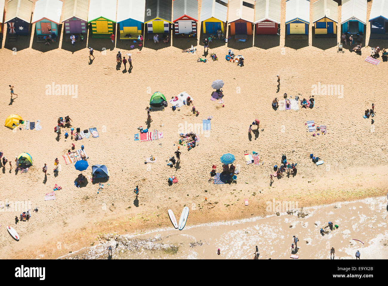 Aerial view of holiday makers and beach huts on Brighton beach, Melbourne, Victoria, Australia Stock Photo