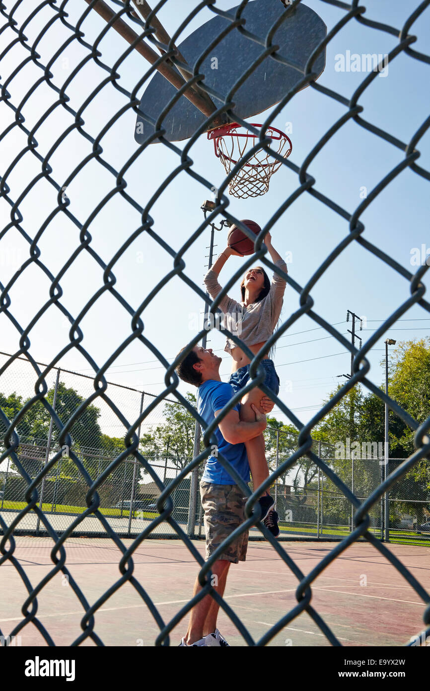 Young couple playing basketball Stock Photo