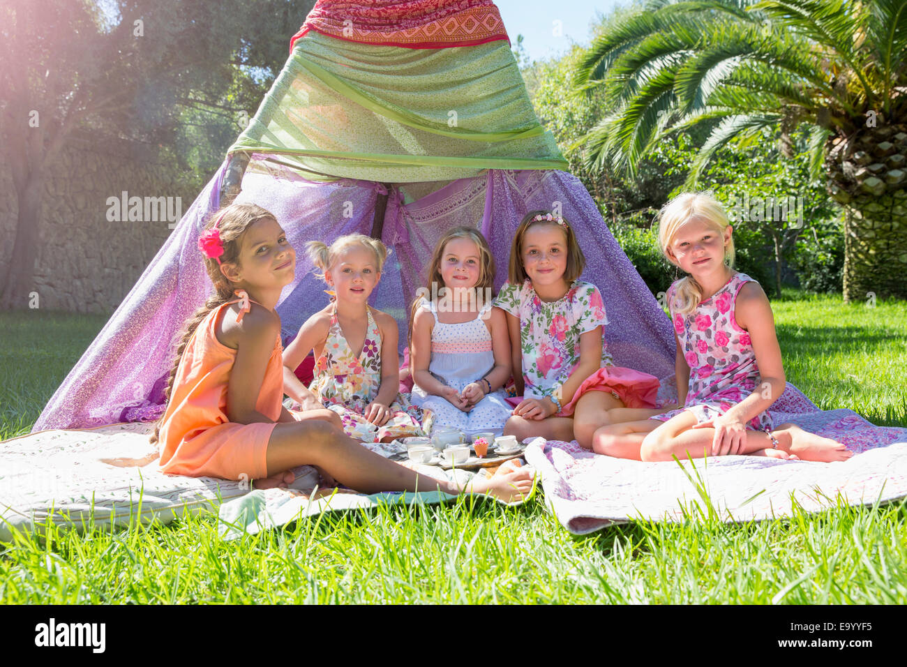 Portrait of five girls in front of teepee Stock Photo