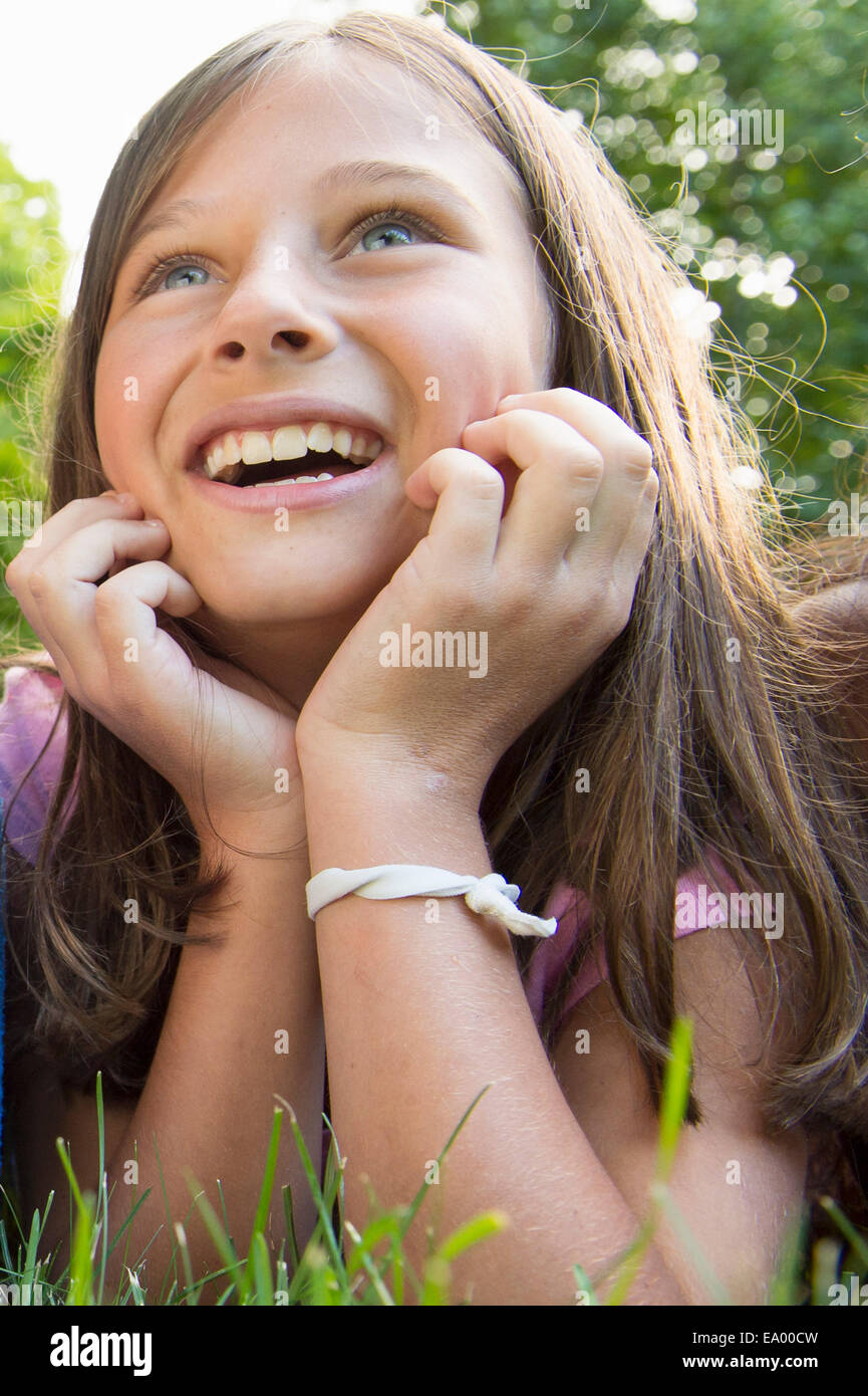 Girl lying on grass Stock Photo Alamy