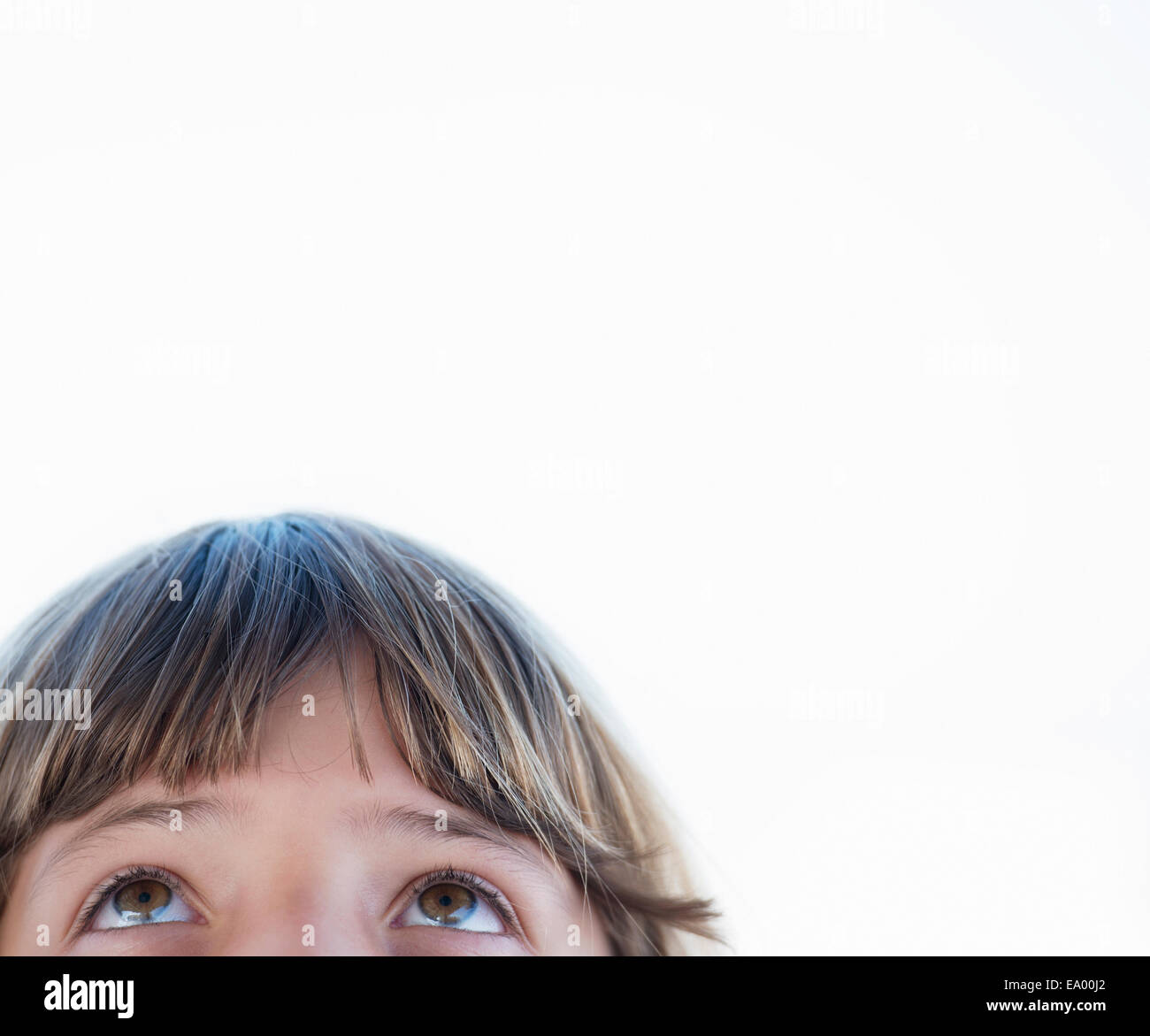 Cropped close up portrait of girl looking upward Stock Photo