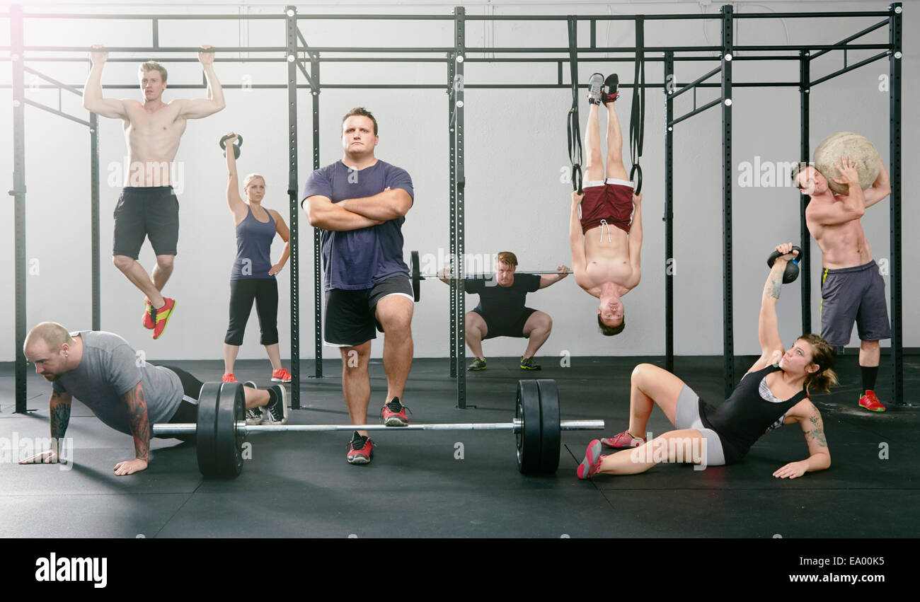 Portrait of eight men and women active in gym Stock Photo
