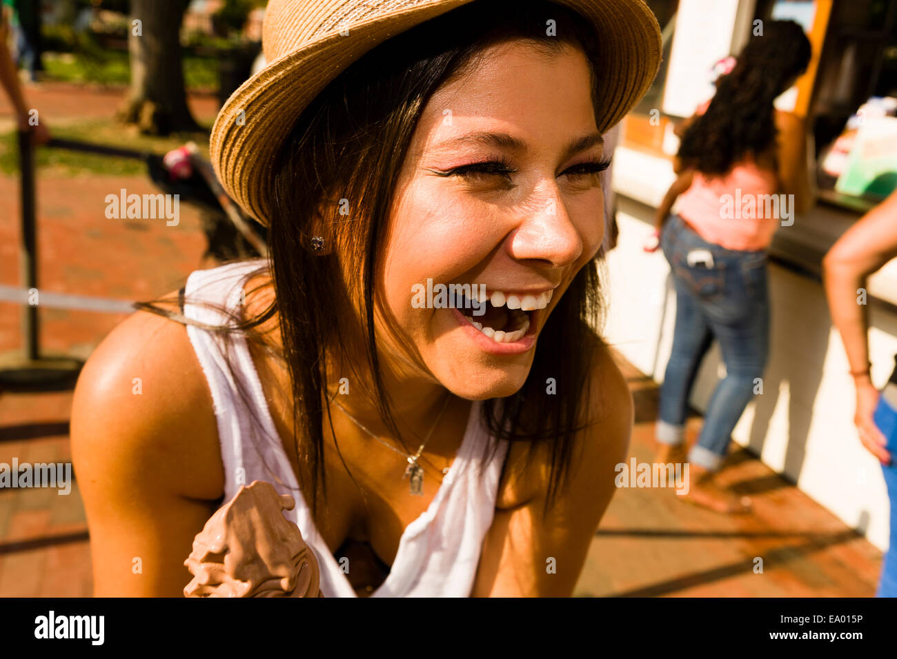 Young woman laughing in park Stock Photo