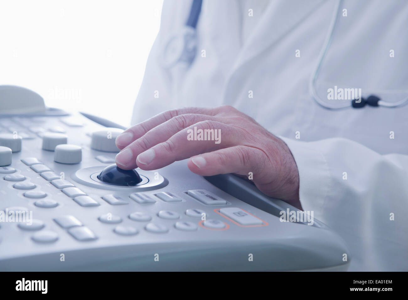 Doctor operating ultrasound scanner Stock Photo