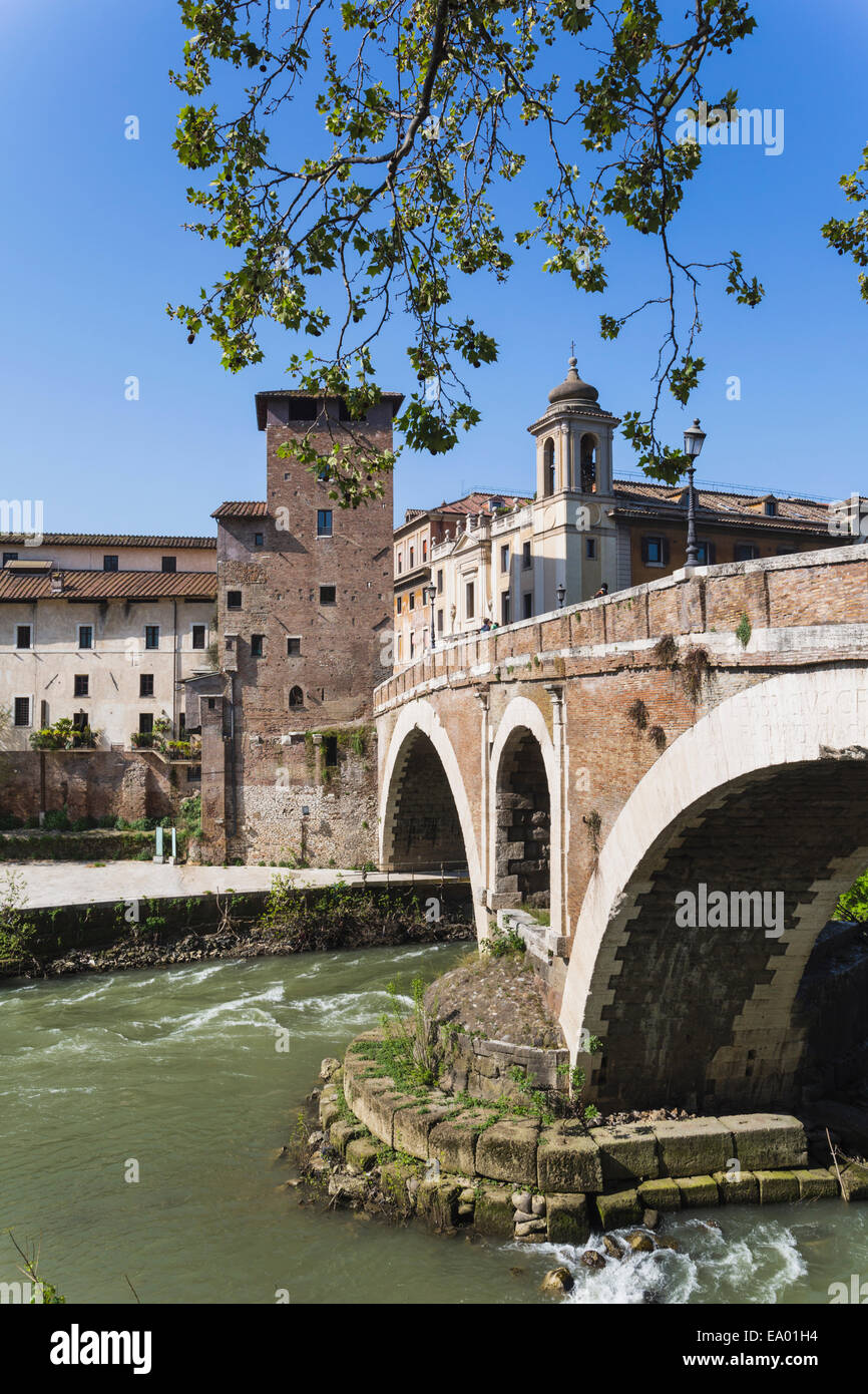 Rome, Italy.  Isola Tiberina or Tiber Island with the Ponte Fabricio built in the first century BC. Stock Photo