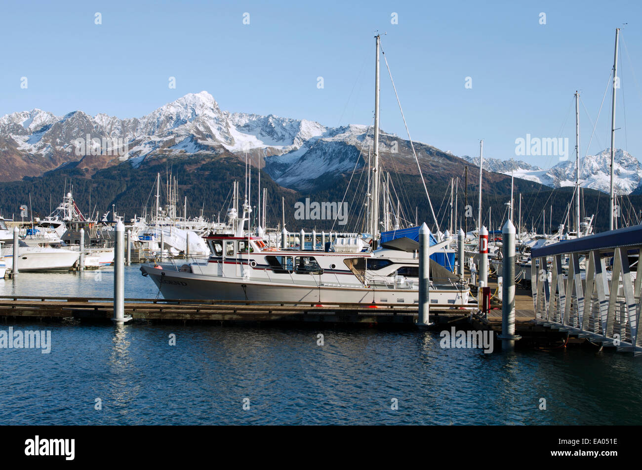 Boats in Seward Harbour with a mountain view Stock Photo