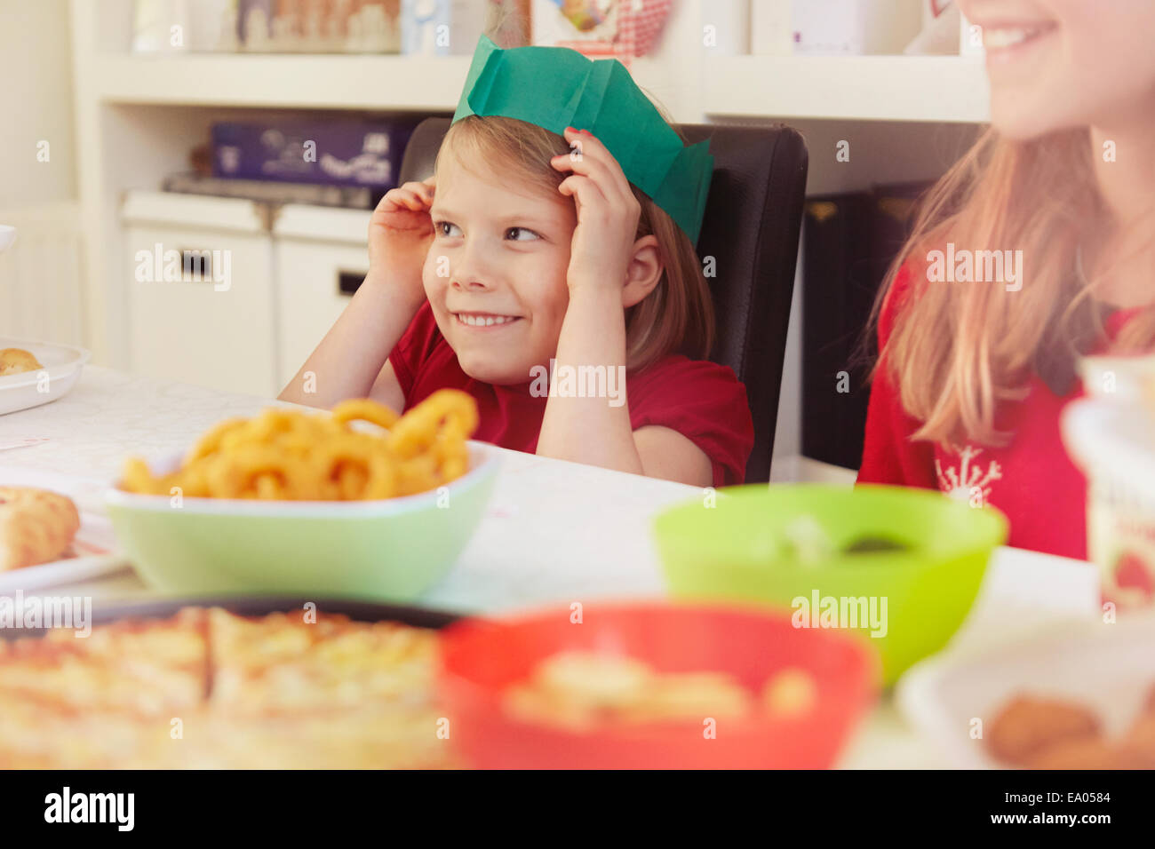 Children wearing paper crowns at christmas Stock Photo Alamy