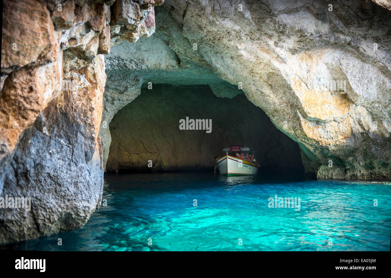 Tourist boat in the Blue Grotto sea caves in Malta Stock Photo - Alamy