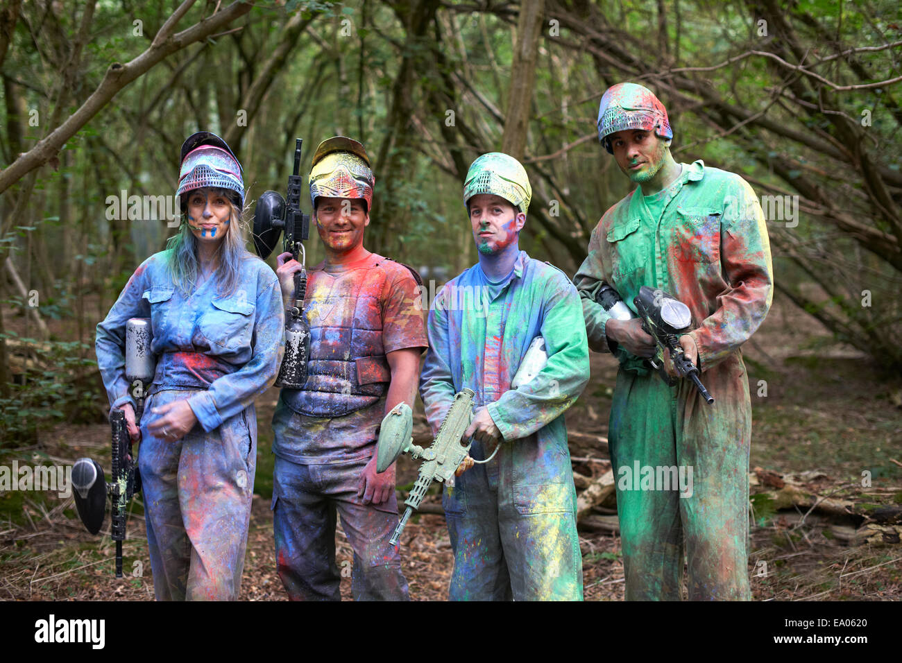 Paintball players in paintball wear marked with paint Stock Photo