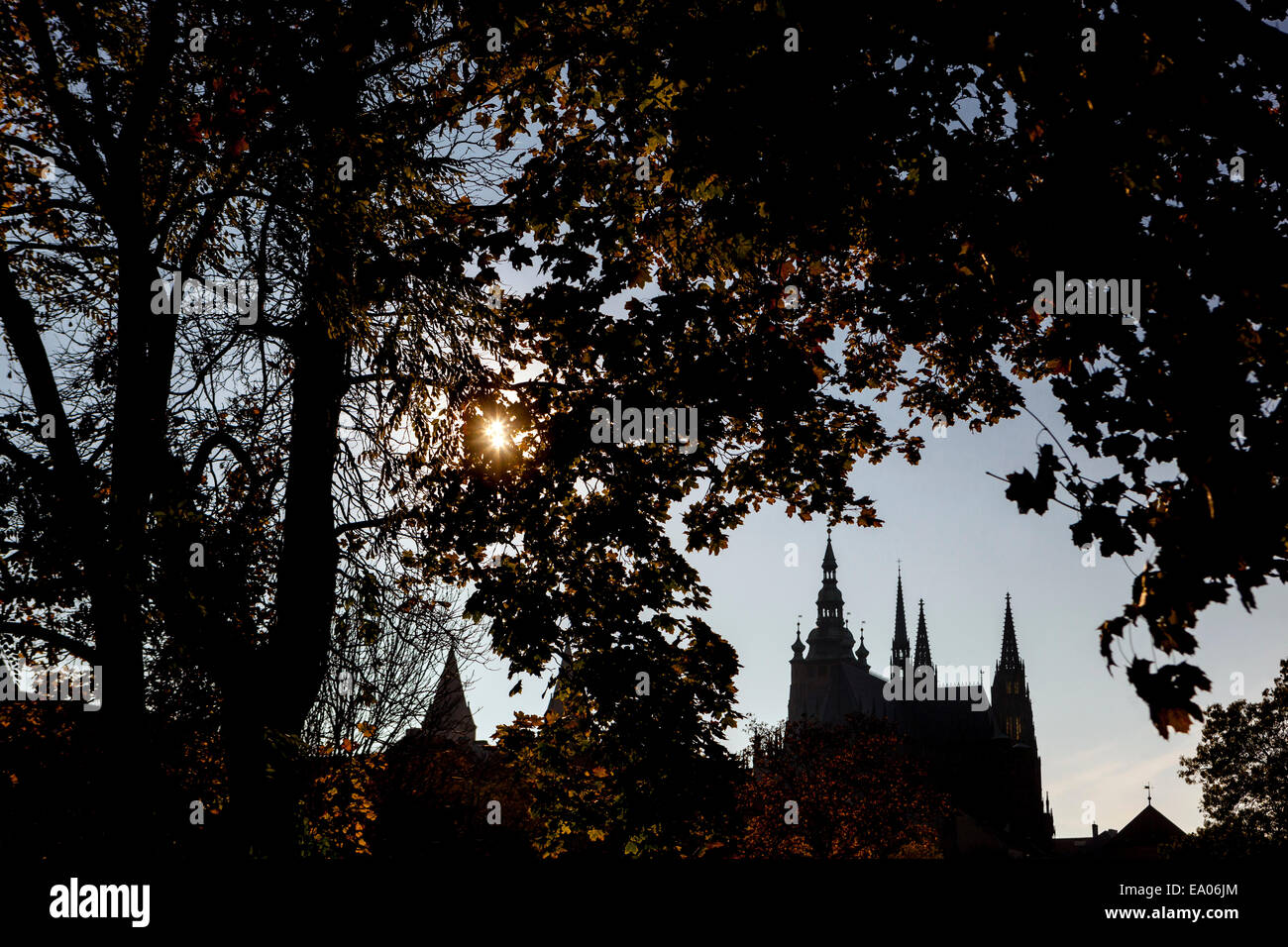 St Vitus Cathedral Prague from Royal Garden, Prague Castle sunset silhouette of Cathedral setting sun behind the towers Stock Photo