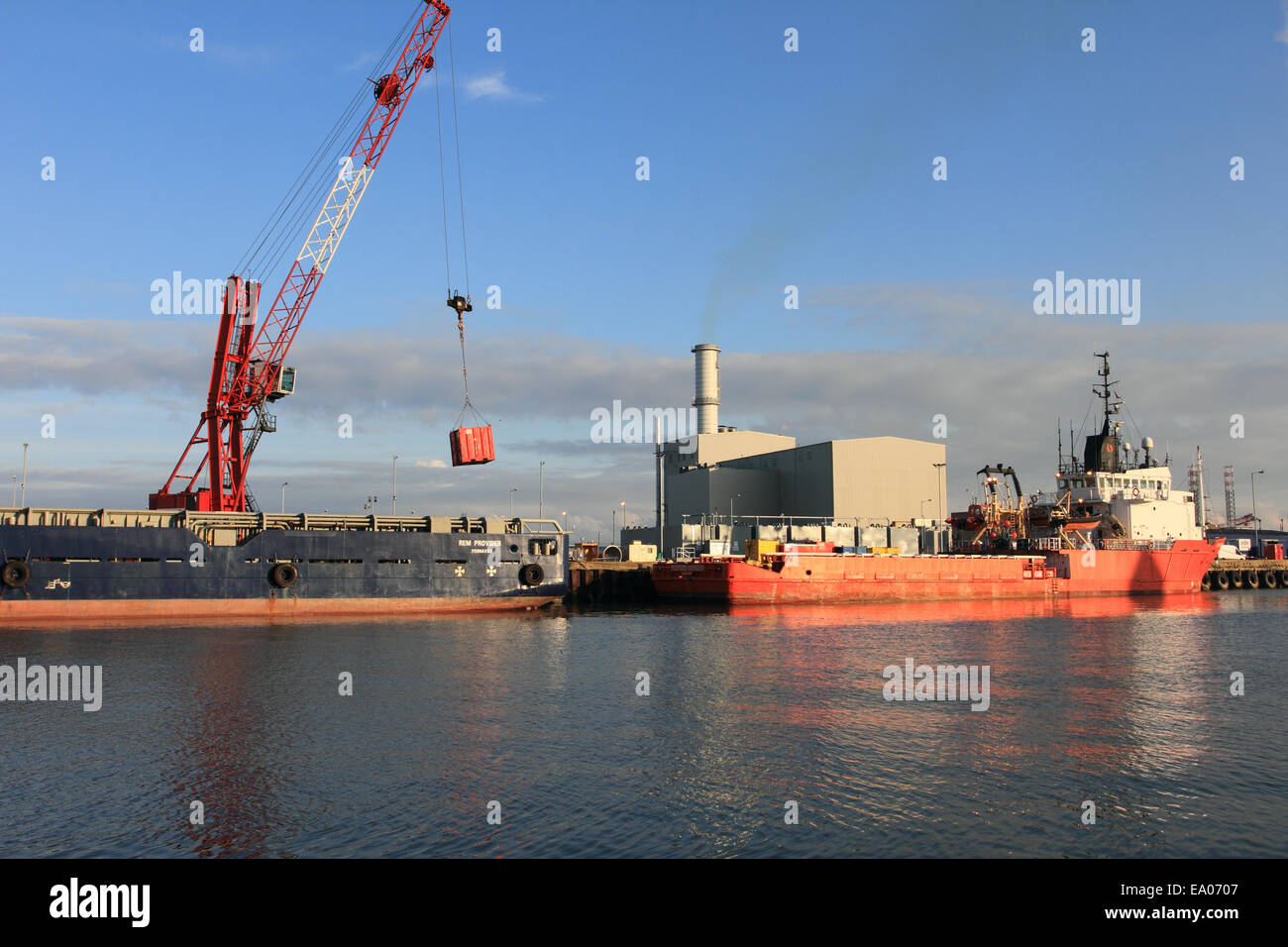 unloading goods, ship at Great Yarmouth harbour, Norfolk,United Kingdom Stock Photo