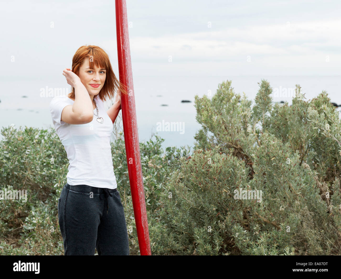 Female surfer with longboard surfboard, Williamstown beach, Melbourne