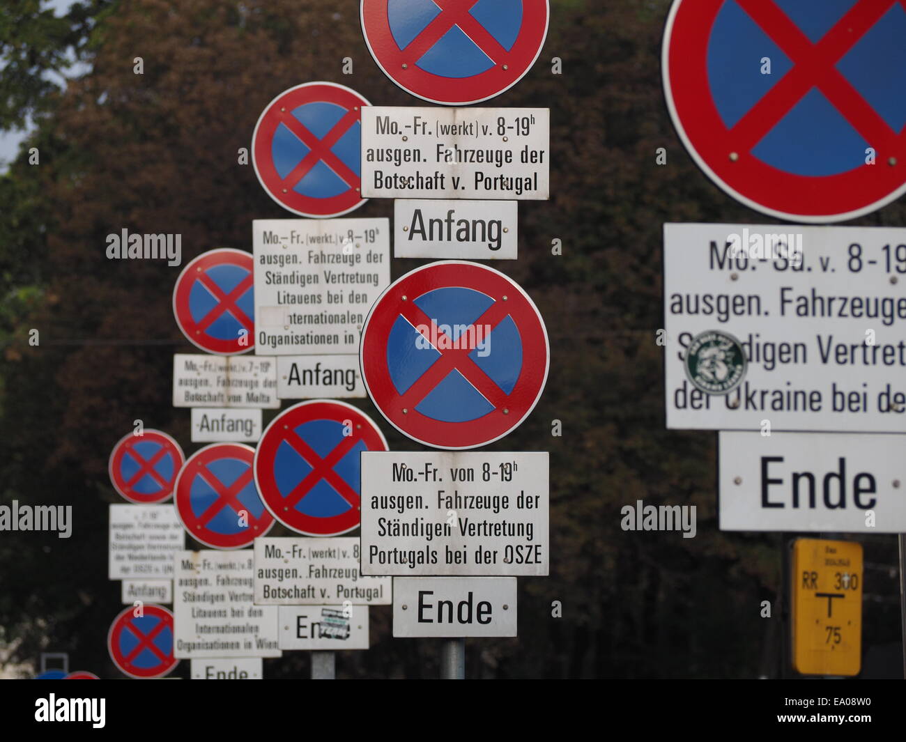 Signpost madness with repetitive roadsigns alongside central Vienna highway giving details of traffic regulation Stock Photo