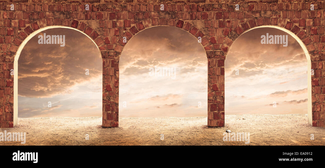 Interior with brick columns and red sky outside. Stock Photo