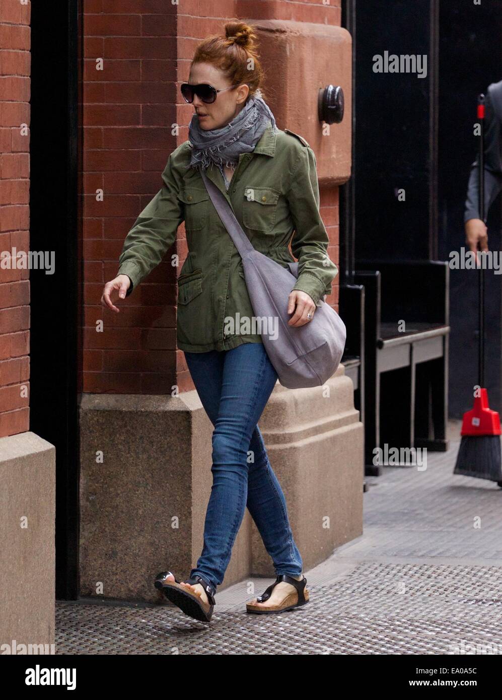 Julianne Moore spotted in Soho wearing a utility jacket and sandals  Featuring: Julianne Moore Where: New York City, New York, United States  When: 02 May 2014 Stock Photo - Alamy