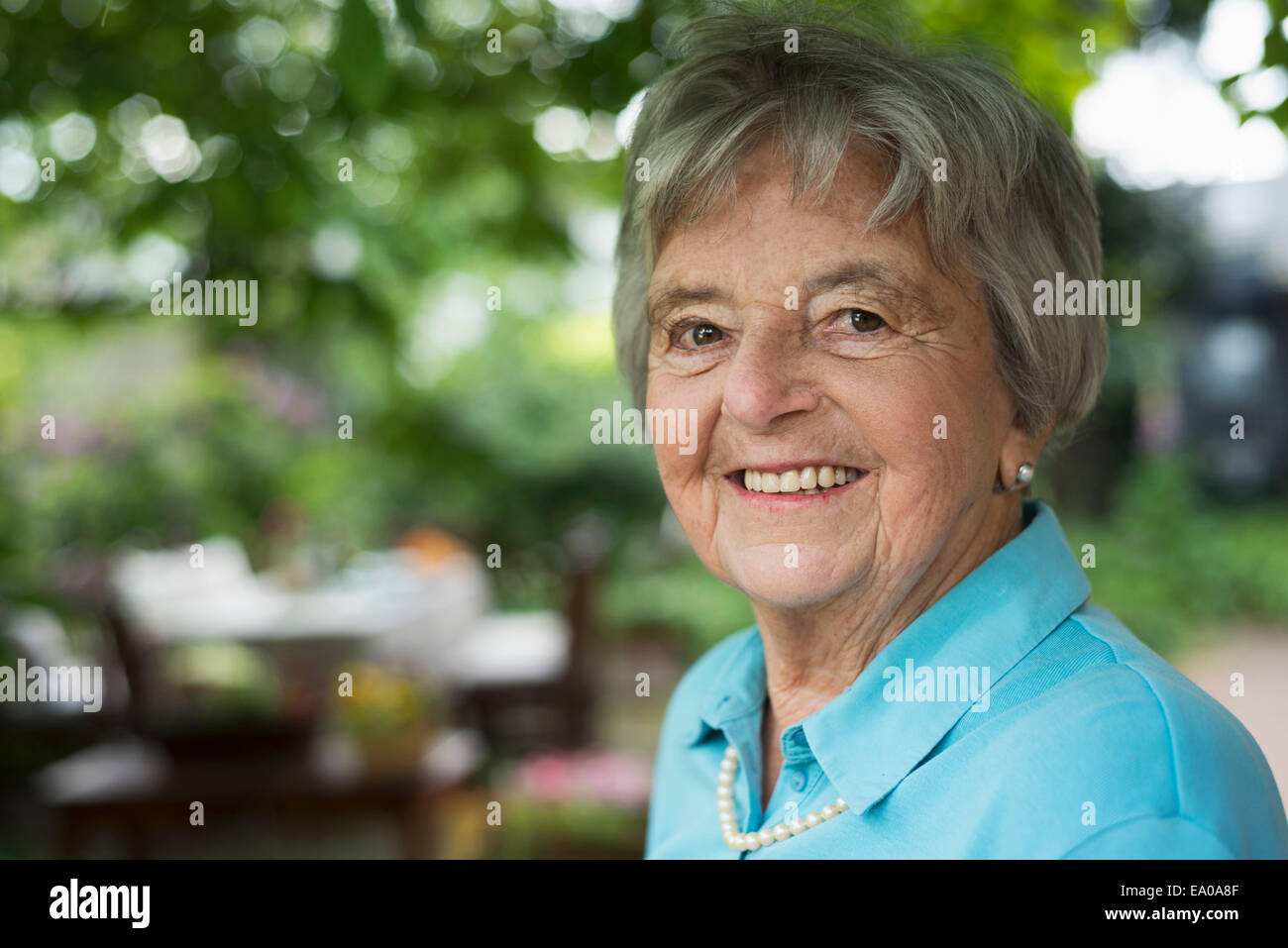 Senior woman in garden Stock Photo