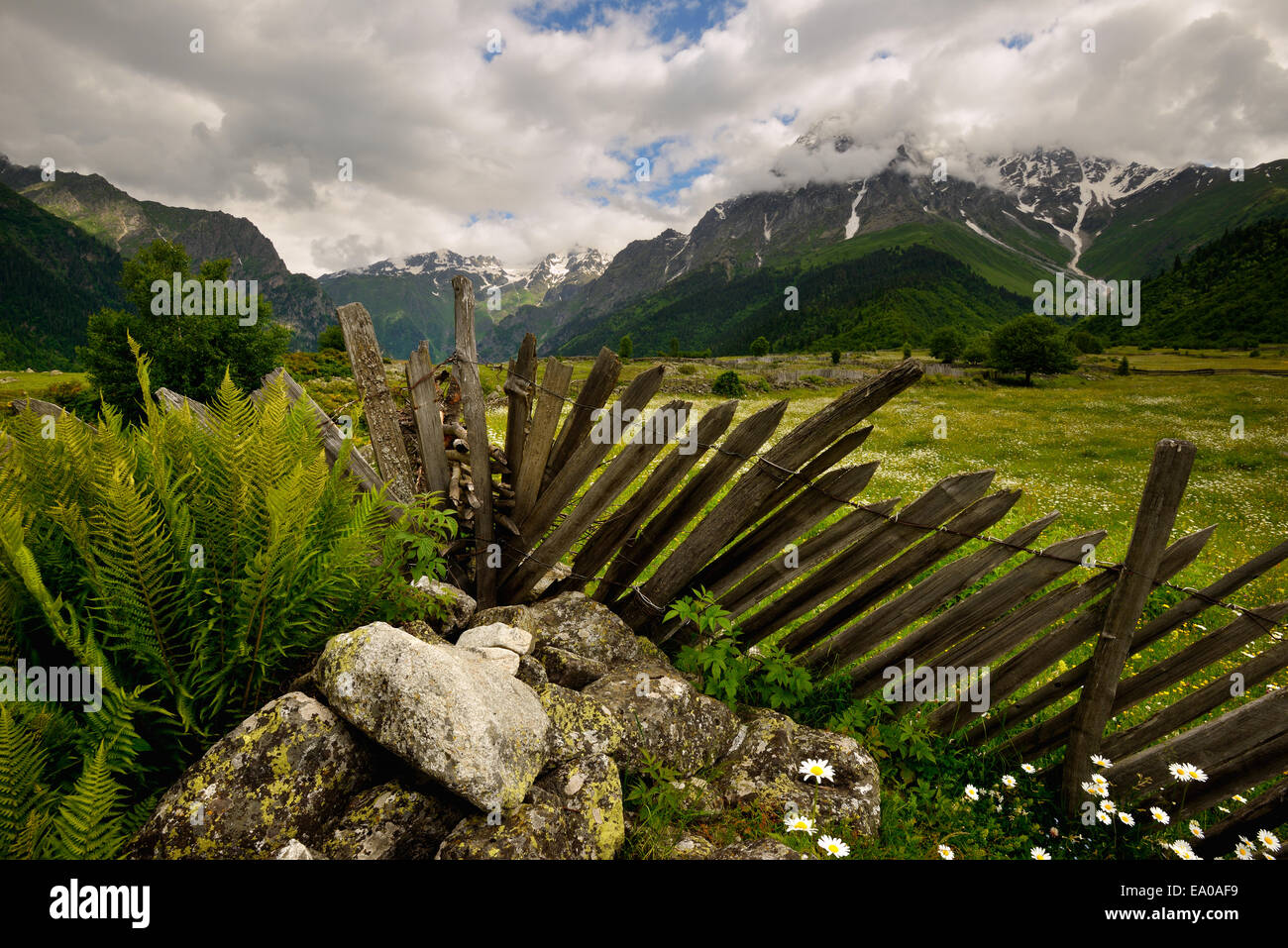 Fence and distant mountains, Mazeri village, Svaneti, Georgia Stock Photo