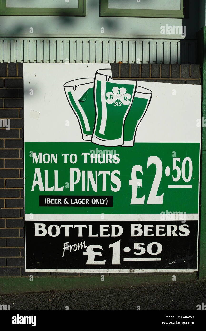 poster on wall of Irish pub advertising cheep beer, in Luton Stock Photo