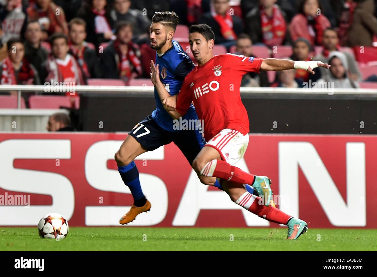 Lisbon, Portugal. 4th Nov, 2014. Andre Almeida (R) of Benfica vies with Yannick Ferreira Carrasco of Monaco during their Champions League Group C soccer match in Lisbon, Portugal, on Nov. 4, 2014. Benfica won 1-0. Credit:  Zhang Liyun/Xinhua/Alamy Live News Stock Photo