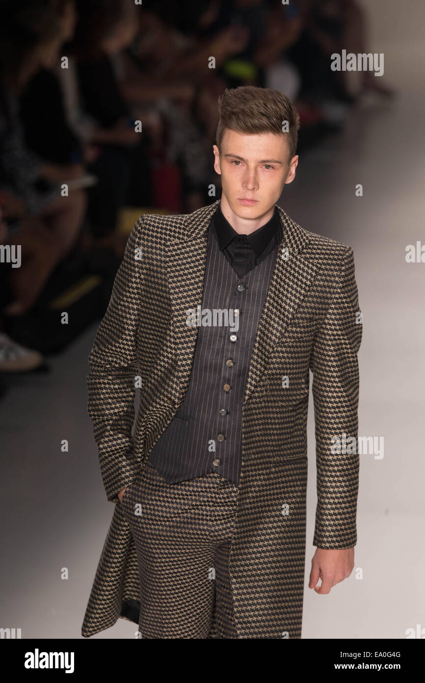 Sao Paulo. 4th Nov, 2014. A model presents a creation of Joao Pimenta ...