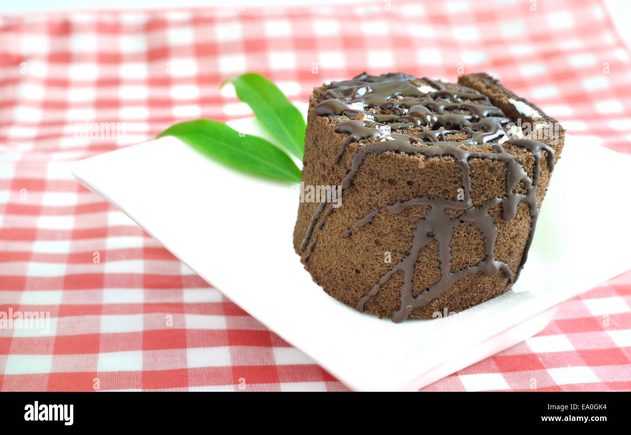 Chocolate roll cake on plate Stock Photo