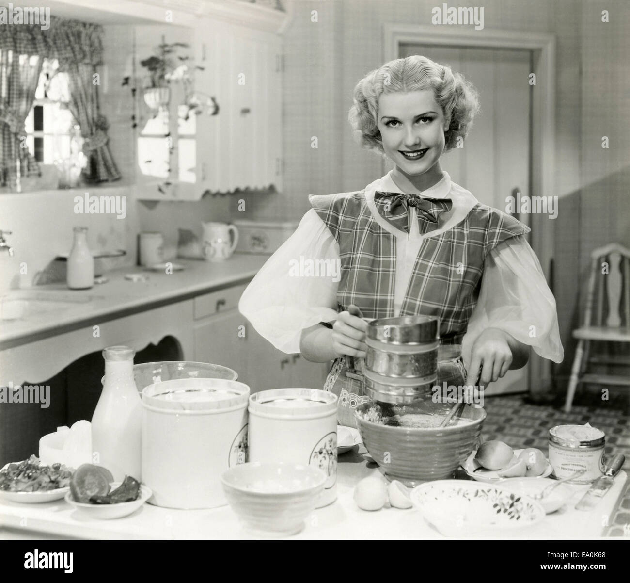 Domestic goddess baking in the kitchen Stock Photo - Alamy