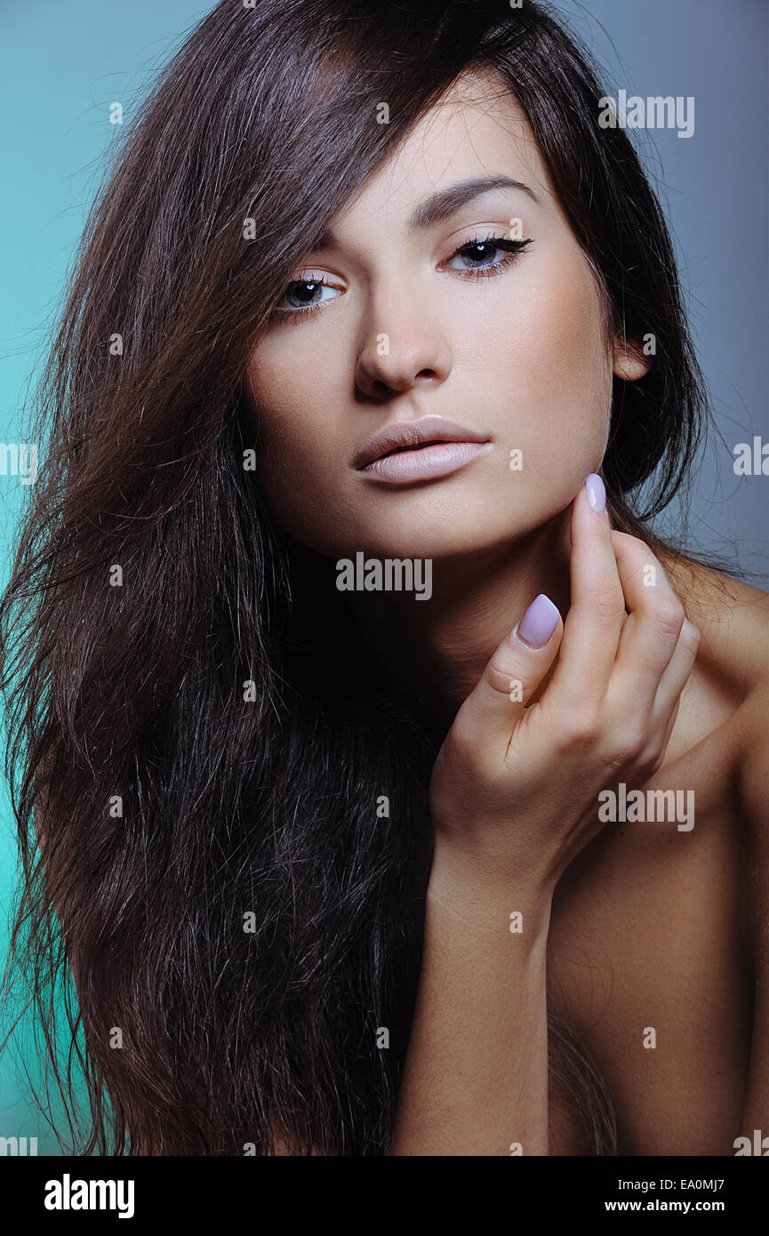 beautiful girl with perfect fresh skin touching her face Stock Photo ...