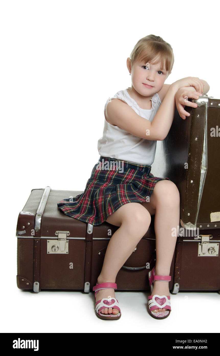The little girl on old suitcases Stock Photo Alamy