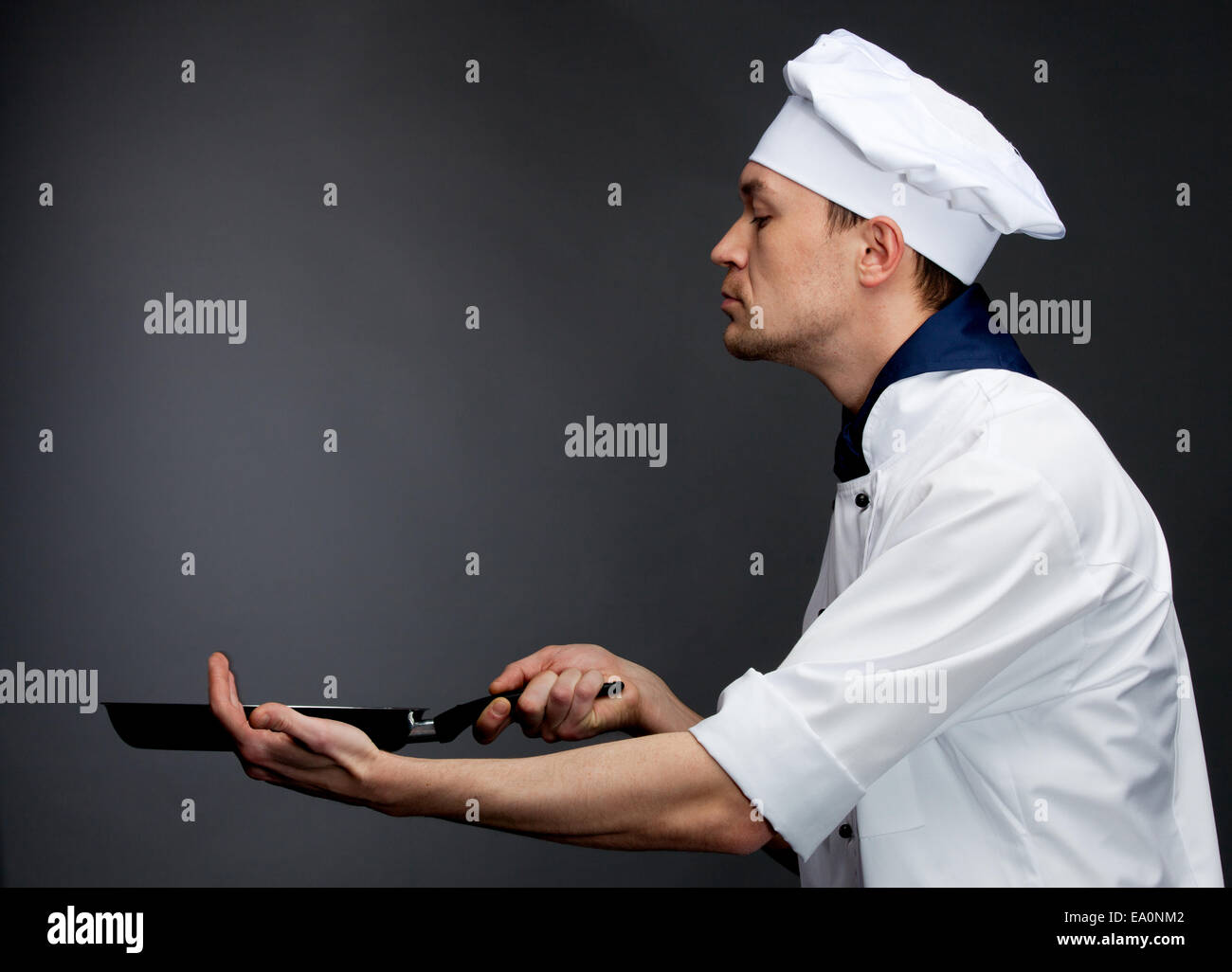 chef holding pan Stock Photo Alamy