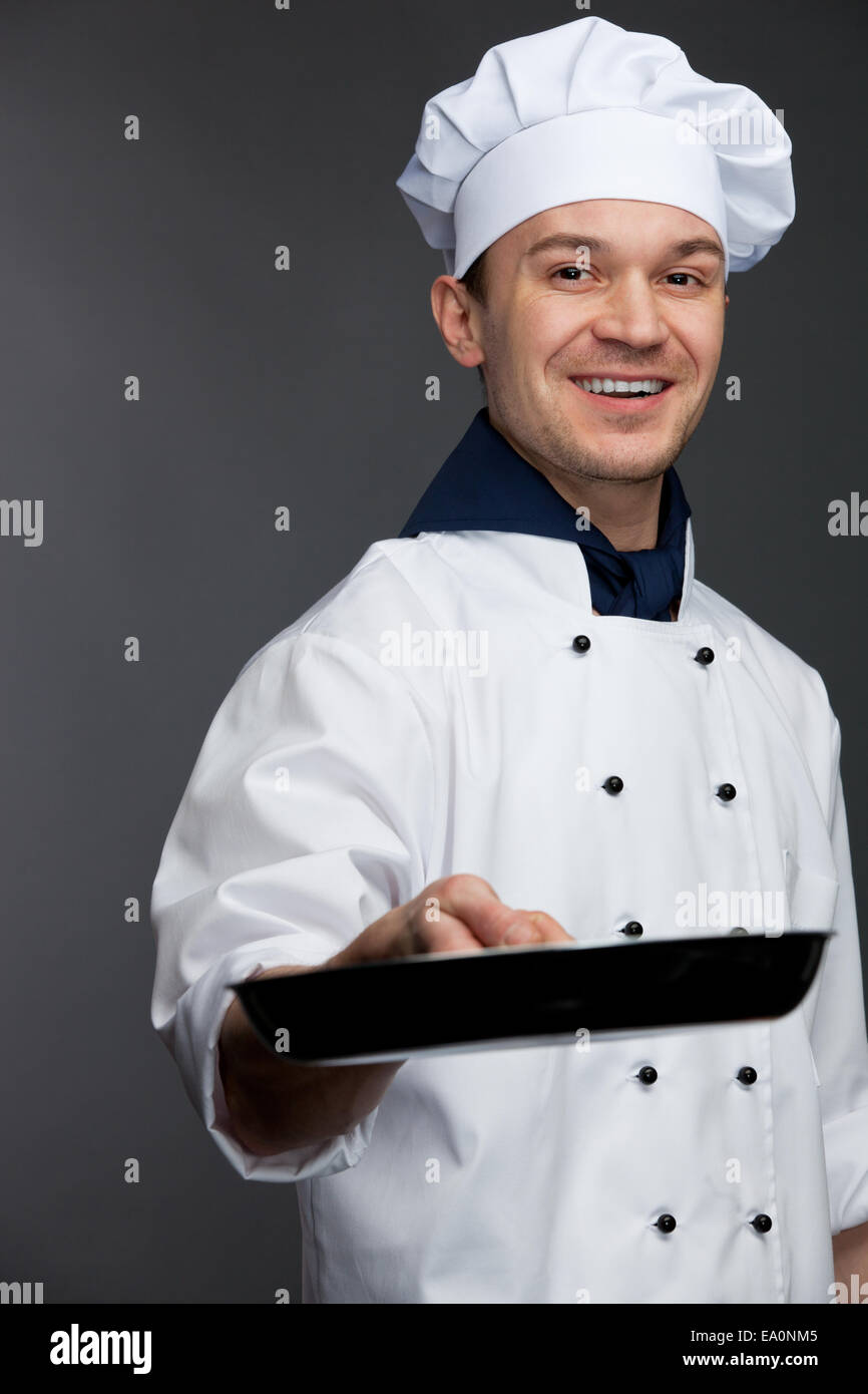 chef holding pan Stock Photo Alamy