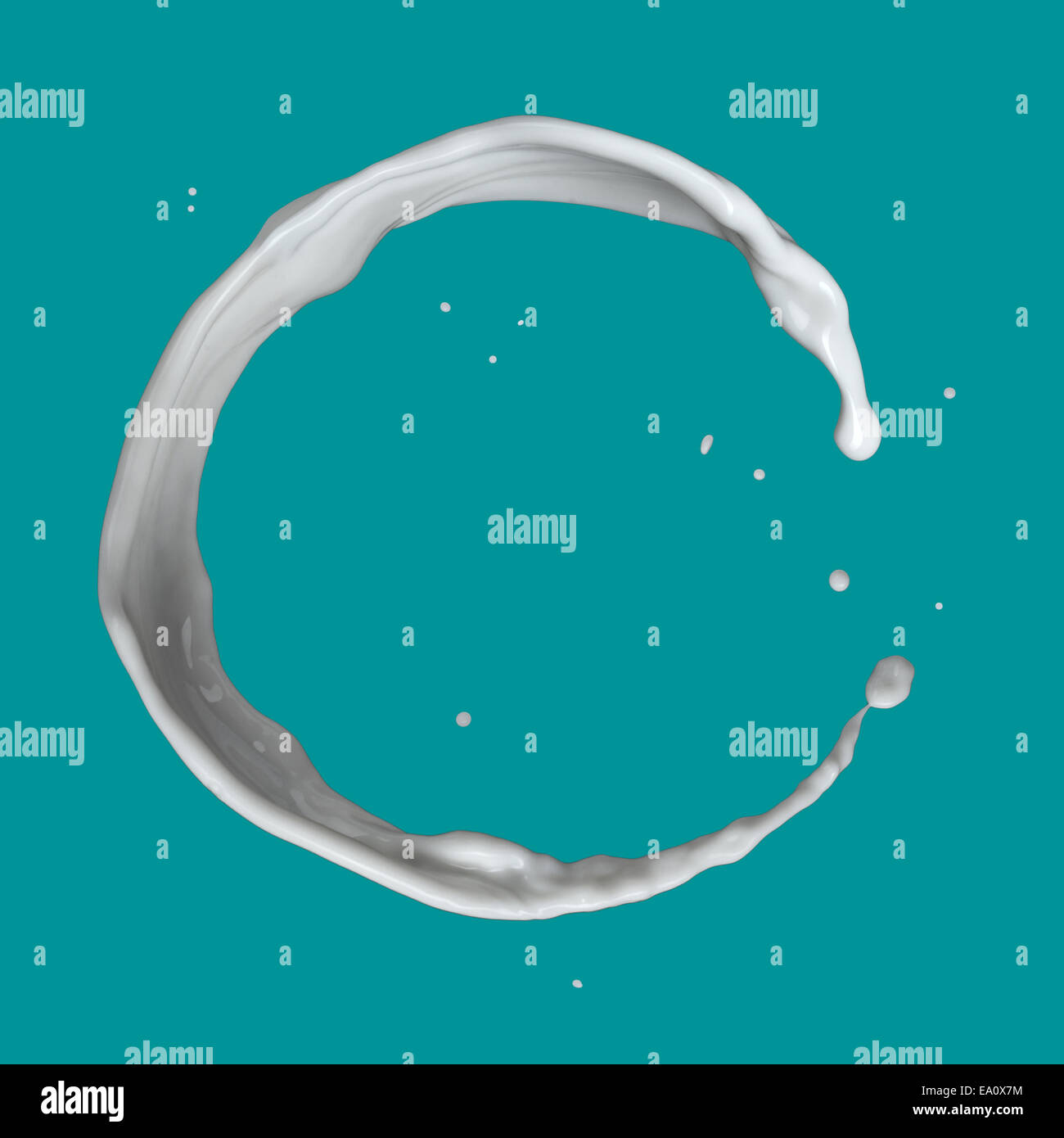 milk splash isolated on blue background Stock Photo - Alamy