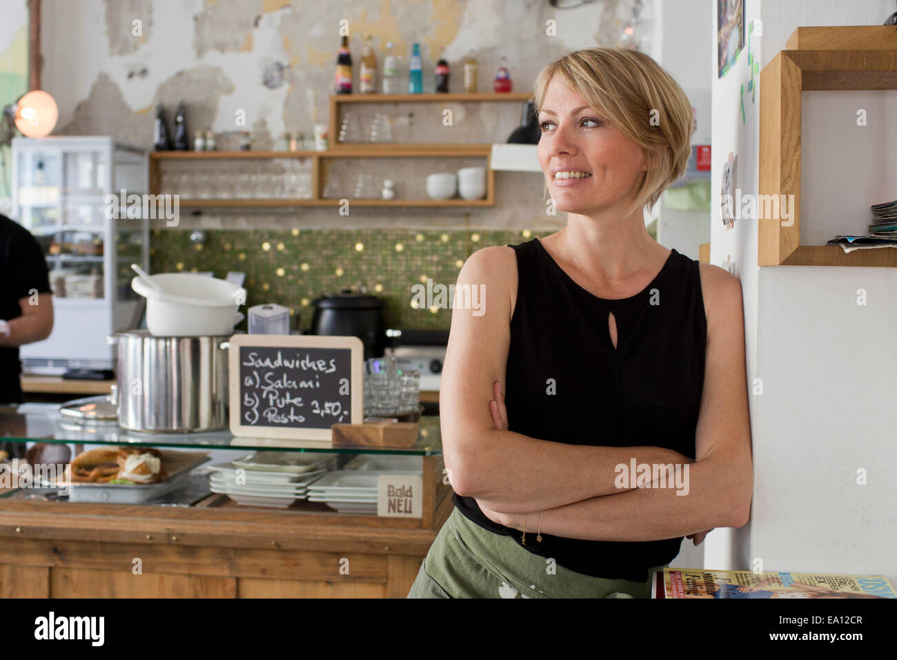 Mid adult woman in cafe Stock Photo