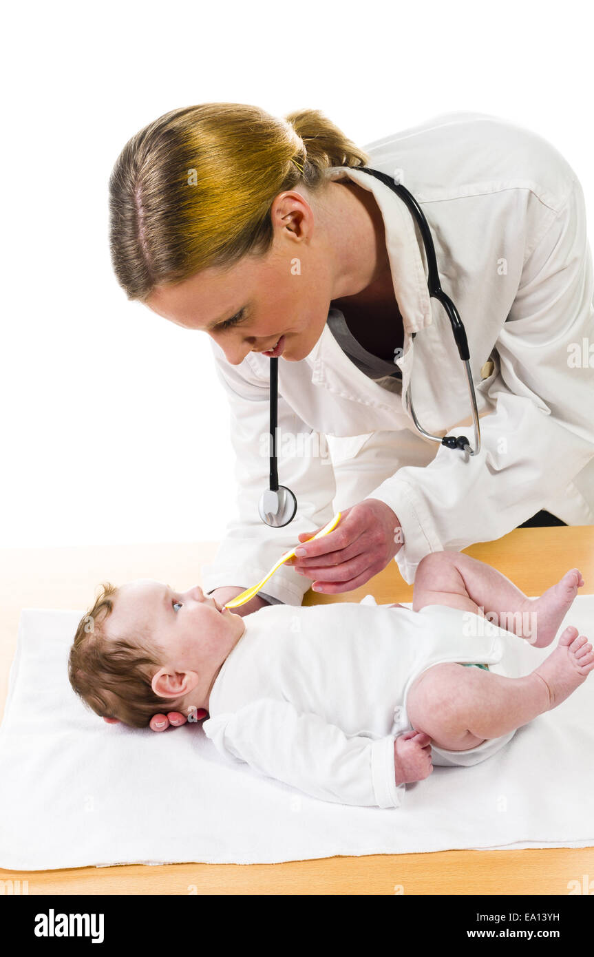 Baby taking medicine Stock Photo