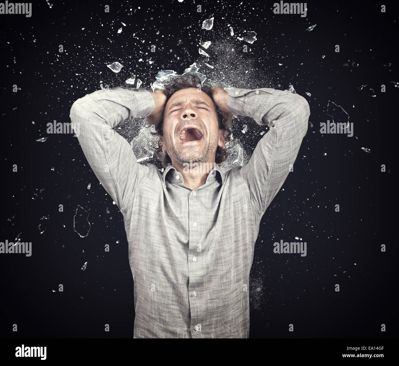 stressed man and background explosion Stock Photo - Alamy