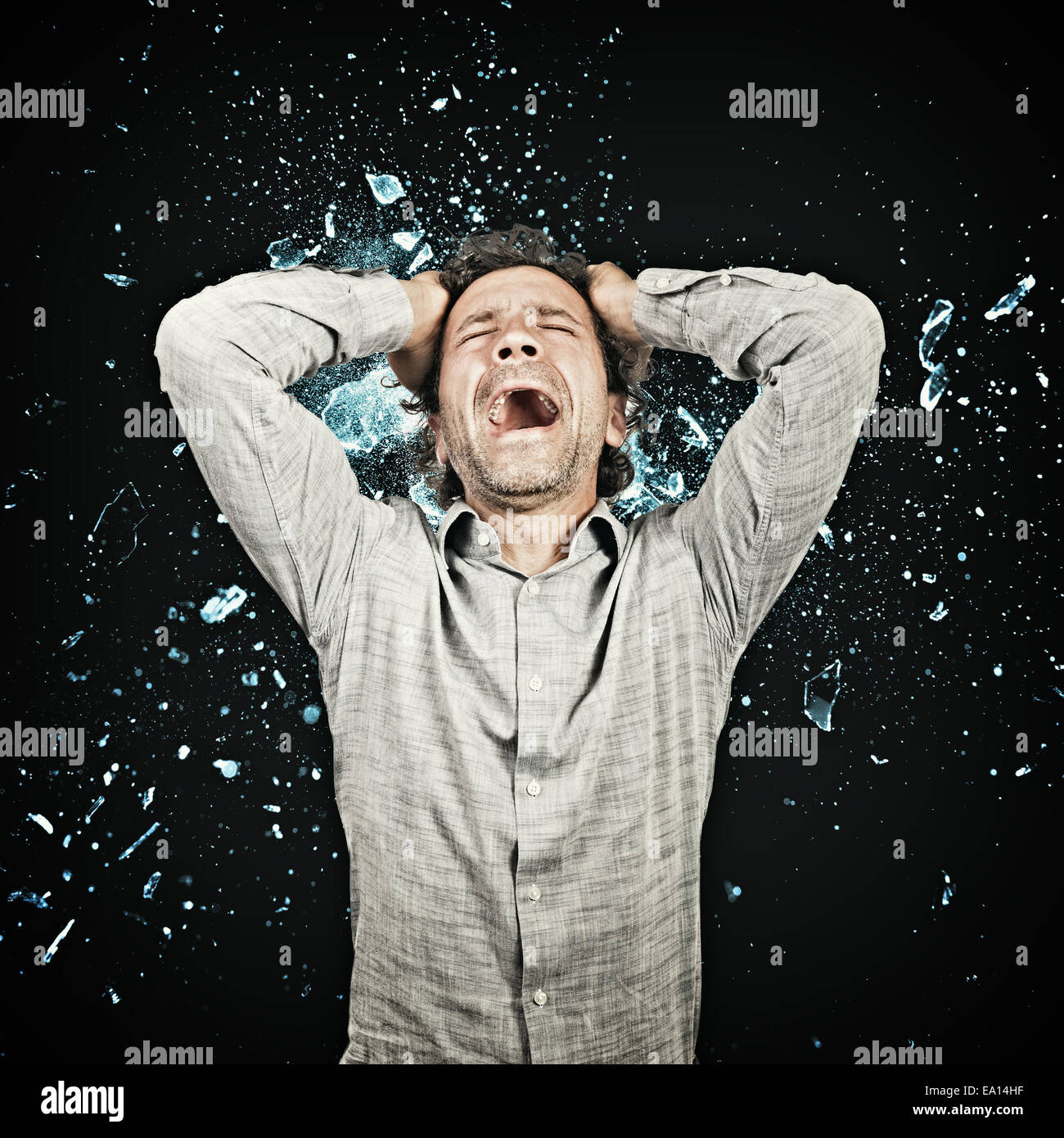 stressed man and background explosion Stock Photo