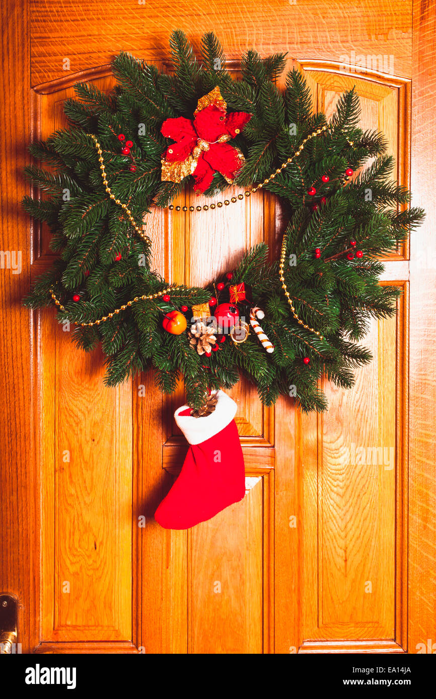 Christmas Wreath With Red Sock On The Door Stock Photo 75013634