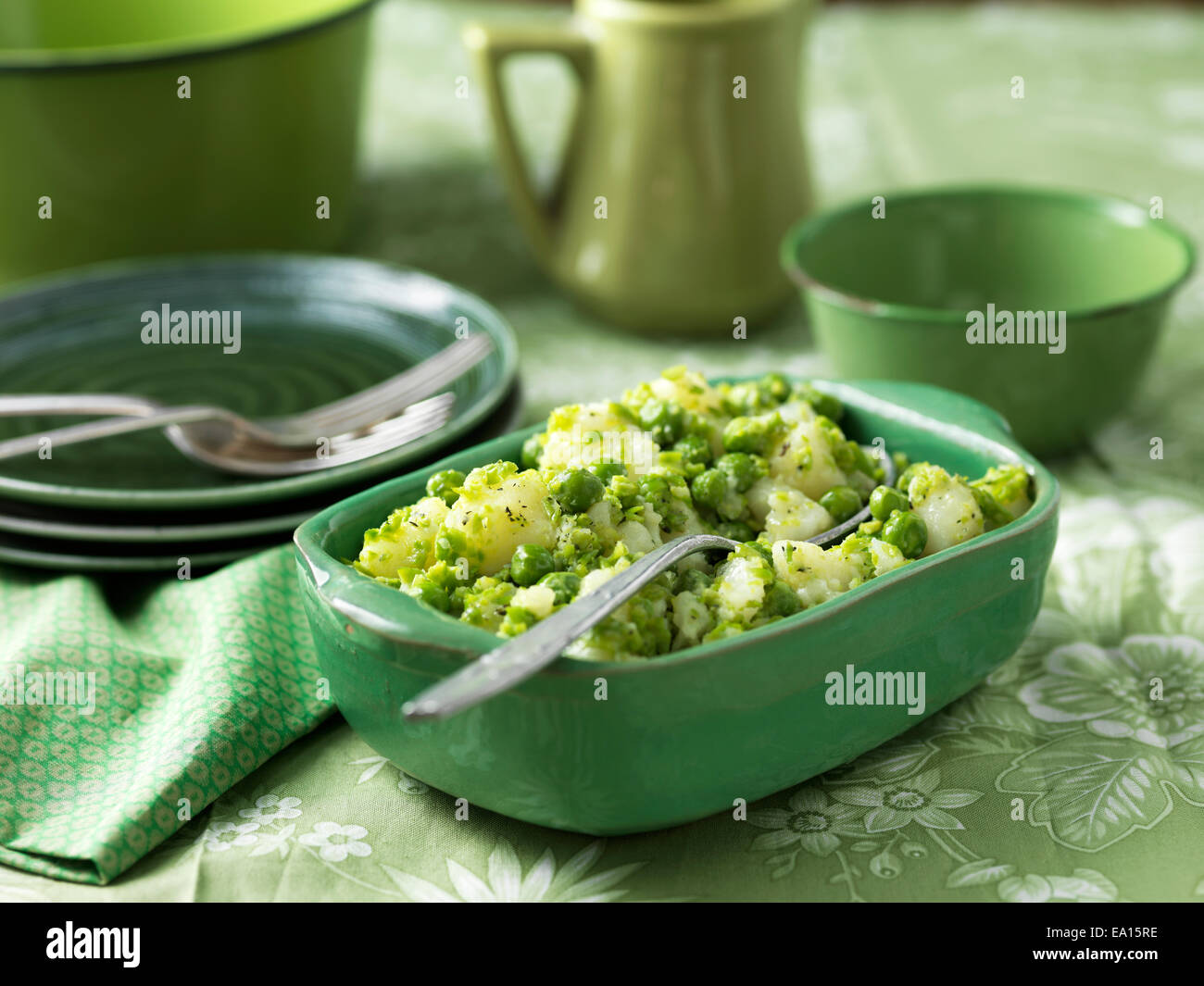 Potatoes and peas salad with minted butter Stock Photo - Alamy