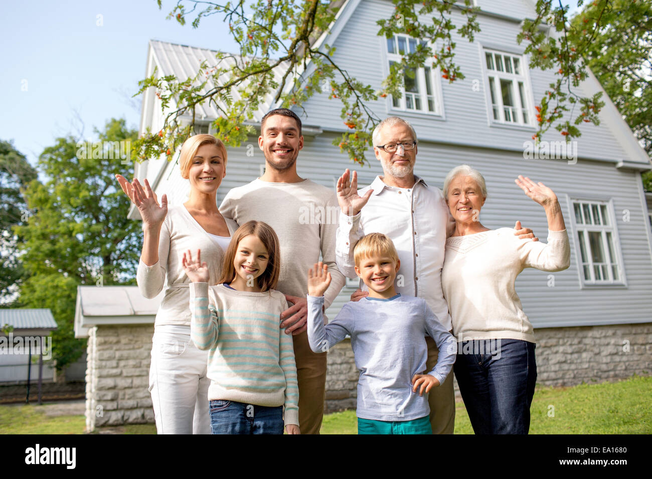 happy family in front of house outdoors Stock Photo - Alamy
