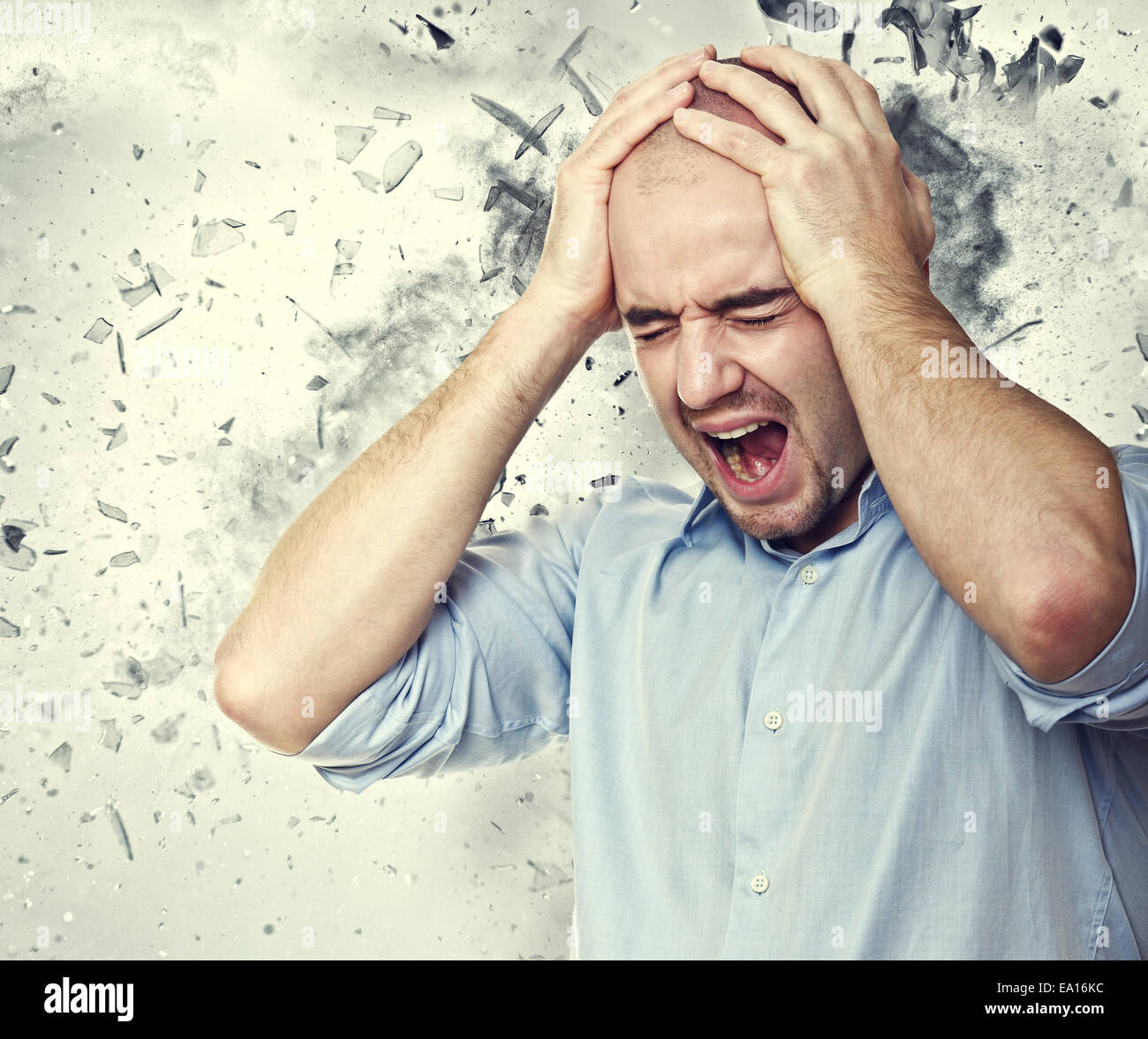 stressed man and background explosion Stock Photo - Alamy
