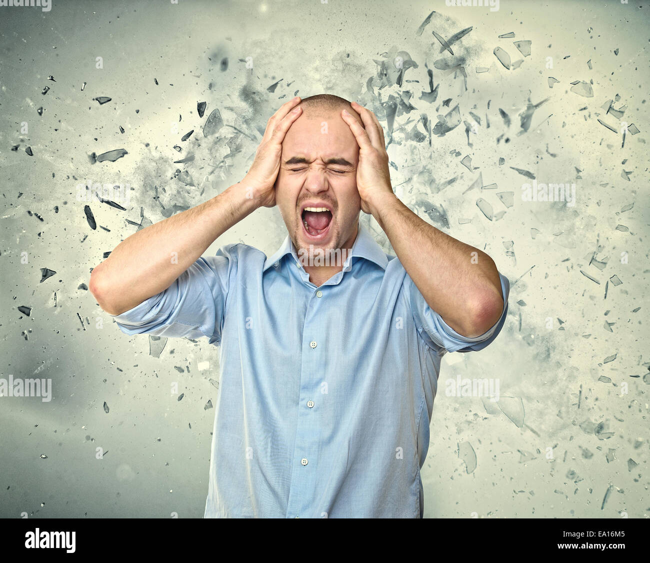 stressed man and background explosion Stock Photo - Alamy