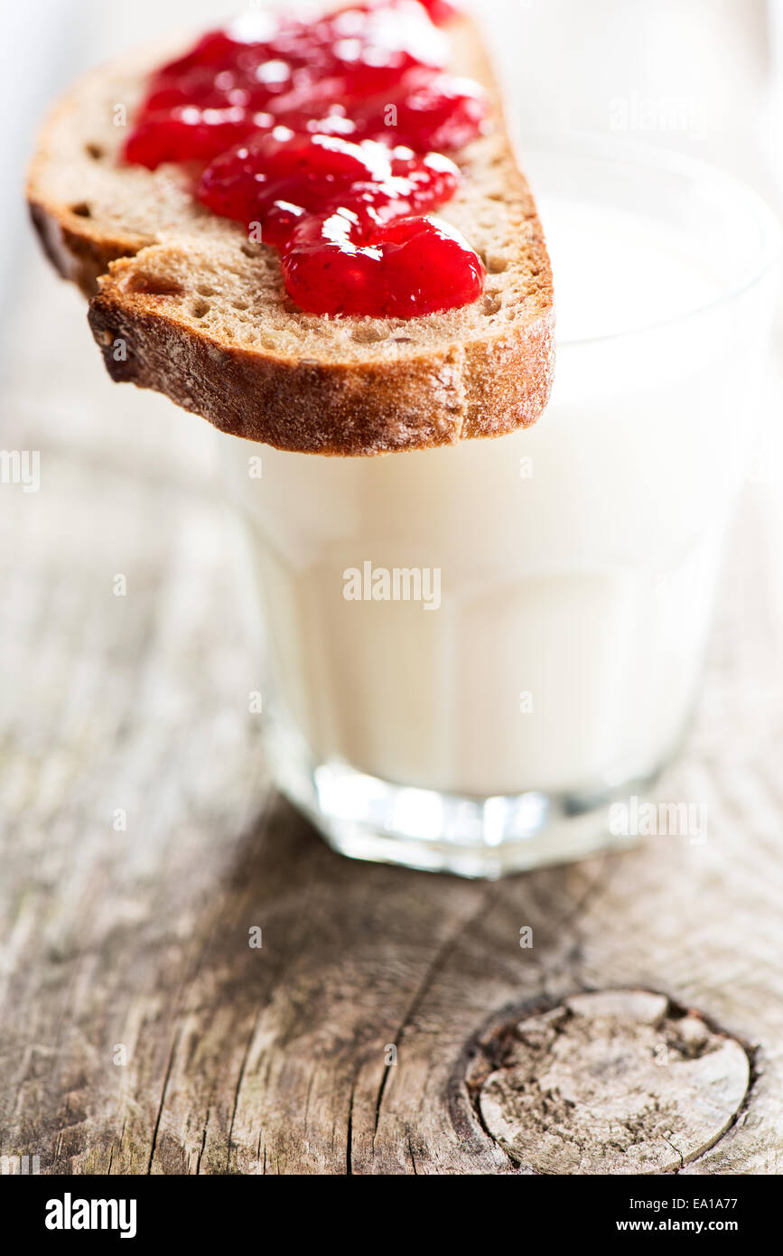 Bread with strawberry jam and glass of milk Stock Photo Alamy